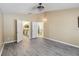 Bedroom with recessed lighting and luxury vinyl plank flooring, bathroom and kitchen access at 784 Seneca Trl, St Cloud, FL 34772