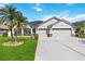 Charming single-story home featuring a well-manicured lawn and a two-car garage at 784 Seneca Trl, St Cloud, FL 34772