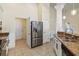 Spacious kitchen features granite countertops and stainless steel refrigerator at 784 Seneca Trl, St Cloud, FL 34772
