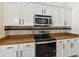 Updated kitchen featuring stainless steel microwave and oven at 784 Seneca Trl, St Cloud, FL 34772