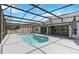 Screened-in pool with cool, clear water and an inviting patio area, perfect for outdoor relaxation at 784 Seneca Trl, St Cloud, FL 34772