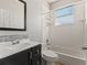 Well-lit bathroom featuring a vanity, mirror, tub, and shower at 834 High Pointe Cir, Minneola, FL 34715