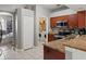 This kitchen features granite countertops, modern appliances, and a convenient laundry area at 834 High Pointe Cir, Minneola, FL 34715