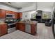 Well-equipped kitchen with stainless steel appliances and opens to a inviting living space at 834 High Pointe Cir, Minneola, FL 34715