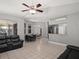 Spacious living area with tile flooring, breakfast bar, and a view of the dining area at 834 High Pointe Cir, Minneola, FL 34715
