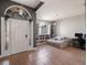 Bright living room features built in bookcases, tile flooring, and front door access at 834 High Pointe Cir, Minneola, FL 34715
