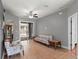 Open-plan living space with tile flooring, ceiling fan and access to the backyard via sliding glass doors at 834 High Pointe Cir, Minneola, FL 34715