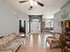 Inviting living room featuring tile floors, a ceiling fan and traditional furnishings at 834 High Pointe Cir, Minneola, FL 34715