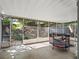Enjoy this covered patio, screened in for relaxation and protection from the elements with trampoline included at 834 High Pointe Cir, Minneola, FL 34715