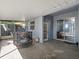 Covered patio with a trampoline, doors to the house, and plenty of space at 834 High Pointe Cir, Minneola, FL 34715