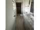 A full bathroom with a tile shower, toilet and vanity at 837 Quintilian Ave, Orlando, FL 32809