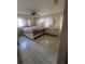 This bedroom offers ceramic flooring, ceiling fan, dresser and bed in this home at 837 Quintilian Ave, Orlando, FL 32809