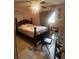 A small bedroom with a ceiling fan and a window at 837 Quintilian Ave, Orlando, FL 32809