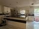 A spacious kitchen with a breakfast bar and white cabinets at 837 Quintilian Ave, Orlando, FL 32809