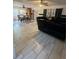 Shows the living room area with dining table, and ceramic flooring in the home at 837 Quintilian Ave, Orlando, FL 32809