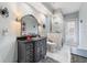 Chic bathroom showcasing a sleek vanity, decorative mirror, and stylish shower area at 8550 Lost Cove Dr, Orlando, FL 32819