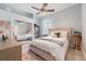 Inviting bedroom features plush carpeting, natural light, and stylish decor at 8550 Lost Cove Dr, Orlando, FL 32819