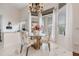 Cozy breakfast nook with glass table, elegant chandelier, and ample natural light at 8550 Lost Cove Dr, Orlando, FL 32819