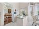 Light-filled breakfast nook near kitchen, with hardwood floors visible from living room at 8550 Lost Cove Dr, Orlando, FL 32819
