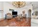 Open-concept living room with stylish décor, hardwood floors, and ample natural light at 8550 Lost Cove Dr, Orlando, FL 32819