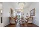 Bright living room with hardwood floors, ornate furniture, and a decorative chandelier at 8550 Lost Cove Dr, Orlando, FL 32819