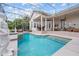 Scenic screened-in pool offering picturesque lake views, patio seating, and access to the home at 8550 Lost Cove Dr, Orlando, FL 32819