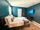 Galaxy-themed bedroom with wall decor, a TV, and comfortable bedding at 9122 Sommerset Hills Dr, Davenport, FL 33896