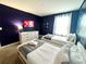 Bright bedroom with two twin beds, soft carpet, and TV for cozy nights at 9122 Sommerset Hills Dr, Davenport, FL 33896
