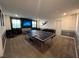 Bright game room with a ping pong table, foosball, and grass-covered wall at 9122 Sommerset Hills Dr, Davenport, FL 33896