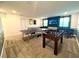 Fun game room with a ping pong table, foosball, and TV for entertainment at 9122 Sommerset Hills Dr, Davenport, FL 33896
