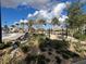 Relax and unwind in the hammock park, surrounded by beautiful landscaping and tropical palm trees at 9122 Sommerset Hills Dr, Davenport, FL 33896