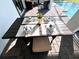 Outdoor dining table set for a meal on the brick patio at 9122 Sommerset Hills Dr, Davenport, FL 33896
