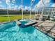 Sparkling spa attached to in-ground pool with screened enclosure, great for entertaining and leisure at 9122 Sommerset Hills Dr, Davenport, FL 33896