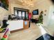 Welcoming reception area featuring modern design and a friendly staff member ready to assist residents and guests at 9122 Sommerset Hills Dr, Davenport, FL 33896