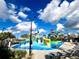 Fun water park area, featuring slides and play areas, for a refreshing and entertaining experience for all at 9122 Sommerset Hills Dr, Davenport, FL 33896