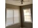Bedroom featuring a ceiling fan and windows that brighten the room at 100 Avenue K Ne, Winter Haven, FL 33881