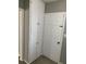Hallway featuring white storage cabinet with interior door at 100 Avenue K Ne, Winter Haven, FL 33881