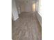 A spacious living room is filled with natural light and features modern flooring and neutral tones at 100 Avenue K Ne, Winter Haven, FL 33881
