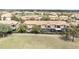 Overhead view of residential property with a golf cart and golf course at 10731 Belfry Cir, Orlando, FL 32832