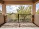 Balcony view of landscape with stone pillars and a view of a lake at 10731 Belfry Cir, Orlando, FL 32832