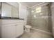 Bathroom featuring single vanity with granite countertop and glass enclosed shower at 10731 Belfry Cir, Orlando, FL 32832