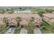 Beautiful townhome with tile roof, two-car garage, brick driveway, and views of the golf course and pond at 10731 Belfry Cir, Orlando, FL 32832