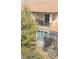 Back exterior with a screened lanai, balcony, and stone veneer accents at 10731 Belfry Cir, Orlando, FL 32832