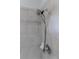Modern chrome shower head against the tiled wall at 10731 Belfry Cir, Orlando, FL 32832