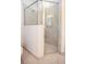Bright bathroom featuring a glass shower with tiled walls and a tiled shower floor at 10731 Belfry Cir, Orlando, FL 32832