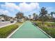 Community bocce ball court with green surface and manicured landscaping at 1107 Trappers Trail Loop, Davenport, FL 33896