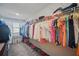 Walk-in closet with shelving, hanging rods, and plenty of storage for shoes and clothing at 1107 Trappers Trail Loop, Davenport, FL 33896
