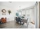 Cozy dining room with modern lighting fixtures and a view to the outdoors at 1107 Trappers Trail Loop, Davenport, FL 33896