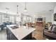 Open-concept kitchen with a large island connecting to the living and dining areas at 1107 Trappers Trail Loop, Davenport, FL 33896