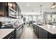 Bright kitchen featuring stainless steel appliances and an open view to the dining area at 1107 Trappers Trail Loop, Davenport, FL 33896